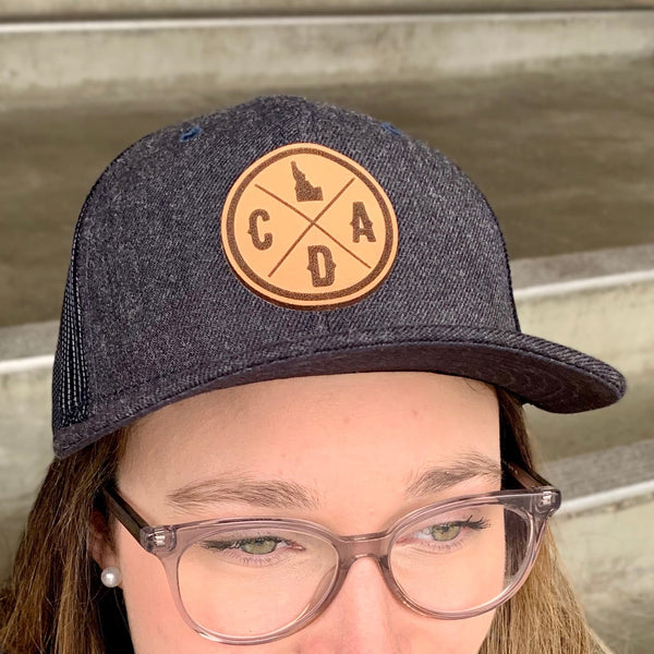 Leather Logo Heather Navy Trucker Patch Hat